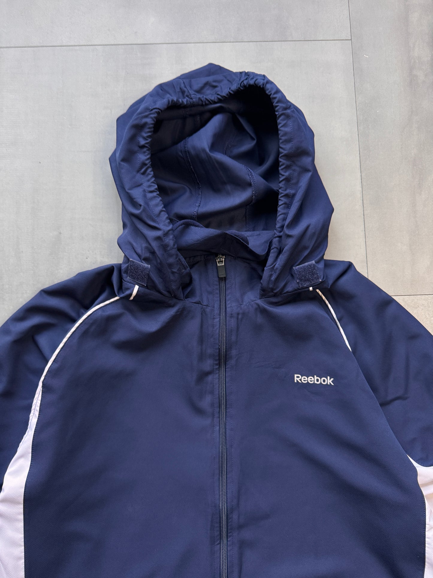 VINTAGE REEBOK NAVY HOODED TRACK JACKET - L